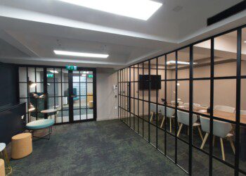 Meeting room with Crittall-style room divider Meeting room with Crittall-style room divider