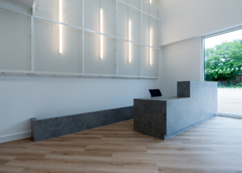 Reception desk at Integration House concrete minimalist reception desk