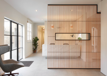 Slatted timber room divider in reception area at Define Clinic Slatted timber room divider in reception area at Define Clinic