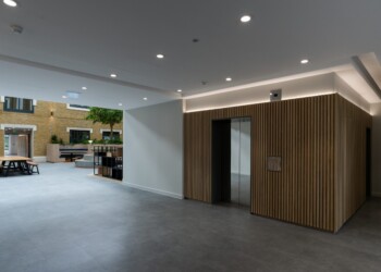 Timber clad lift area at One Arlington Square Timber clad office lift