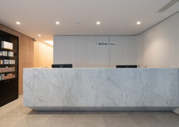 Reception desk at Define Clinic white marble reception desk