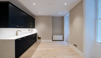 Office kitchen space at 21 Bedford Square Black office kitchen
