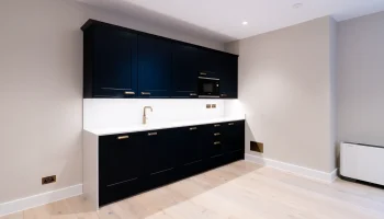 Office kitchen space at 21 Bedford Square modern black kitchen units
