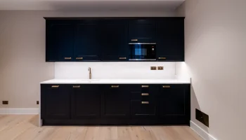 Office kitchen space at 21 Bedford Square black modern kitchen