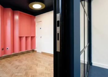 Interior at Olympia Henley Suite orange and navy decorated room with parquet wood flooring