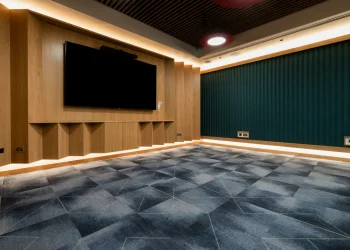 Meeting room facility at Olympia Henley Suite Modern meeting room facility with large screen and wood panelled walls