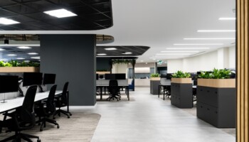 Open plan office floor with planter storage at Acturis Hatton Garden Open plan office floor with planter storage at Acturis office fit out in Hatton Garden