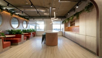 Kitchen and dining area at CL office 3rd floor Arlington Square Modern office kitchen and dining area with booth seating