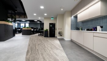 Open plan workspace and kitchen at Acturis office Hatton Garden Open plan workspace and kitchen at Acturis office fit out in Hatton Garden