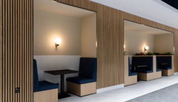 Booth seating at Acturis office Hatton Garden navy booth seating at Acturis office fit out in Hatton Garden