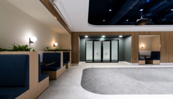 Booth seating at Acturis office Hatton Garden navy booth seating at Acturis office fit out in Hatton Garden